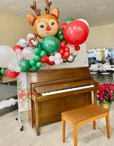 a piano and some balloons in the shape of animals