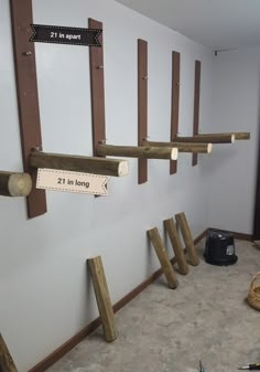 there are several wooden pegs on the wall