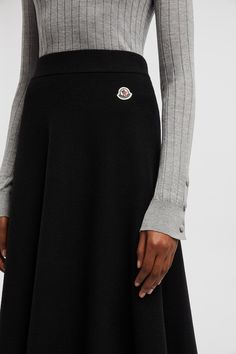 Inspired by timeless fashion, this skirt is crafted from a luxurious blend of Merino wool and cotton. Style with warm knits and refined puffers for a sophisticated winter look. Luxury Black Skirt For Fall, Designer Fall Skirt For Workwear, Designer Skirt For Workwear In Fall, Personalized Jacket, Winter Skirt Outfit, Cotton Midi Skirt, Black Inspiration, Latest Skirts, Winter Skirt