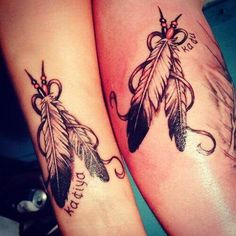 two tattoos with feathers on their legs and words written in the lower part of them