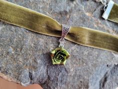 "Velvet choker necklace with handmade rose. The rose is made of polymer clay. Each petal made by hand. Rose about 15 mm/ 0,6\" across. Metal bail in silver color (Bails hole 5*4 mm/ 0,2*0,16 inch). Length of necklace is adjustable: 10-12 inches/ 25,4 - 30,5 cm 11-13 inches/ 28-33 cm 12-14 inches/ 30.5- 35.5 cm 13-15 inches/ 33-38 cm 14-16 inches/ 35.5 cm-40.5 cm 15-17 inches/ 38,1 cm- 43,2 cm 16-18 inches/ 40.6 cm- 45.7 cm 17-19 inches/ 43 cm - 48 cm 18-20 inches 19-21 inches Width of ribbon 20 Adjustable Choker Flower Necklace For Gift, Flower Charm Choker As A Gift, Flower Shaped Choker With Flower Charm As Gift, Gift Flower Pendant Adjustable Choker, Floral Choker With Flower Charm As A Gift, Adjustable Flower Pendant Choker For Gift, Adjustable Flower Pendant Choker Gift, Handmade Green Choker As Gift, Rose Design Choker Jewelry Gift