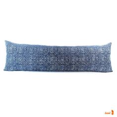 a blue pillow on a white background