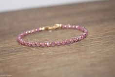 This dainty bracelet features natural and genuine pink sapphire faceted rondelles. The stones are surrounded by gold filled beads. You can select rose gold, gold filled or sterling silver beads. The gemstone beads are strung on high quality beading wire and the bracelet closes with a lobster clasp. I absolutely love the color of these stones. They are gorgeous!! stones- 3.5mm (approx.) Sapphire is the birthstone for the month of September Magnetic clasps are available in gold and silver. If you Pink Faceted Rondelle Beaded Bracelets, Pink Rondelle Bracelet With Faceted Beads, Pink Faceted Rondelle Beads Bracelet, Pink Rondelle Bracelets With Faceted Beads, Pink Rondelle Gemstone Beads Bracelets, Pink Rondelle Beaded Bracelets As Gift, Pink Rondelle Beaded Bracelets For Gifts, Pink Faceted Beaded Bracelet As A Gift, Pink Faceted Beaded Bracelets As A Gift