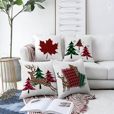 the pillows are decorated with red and green christmas trees, deers, and snowflakes