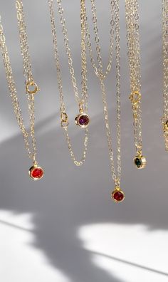 Introducing our exquisite Rebirth Collection - a timeless celebration of elegance and individuality. Our first piece is our Birthstone Necklace, featuring a solitaire birthstone pendant delicately suspended from a graceful chain. Each necklace is 16 inches, however we can make them longer if you need, just leave us a message with the necklace length you want when checking out. January: Garnet February: Amethyst March: Aquamarine April: Diamond May: Emerald June: Alexandrite July: Ruby August: Peridot September: Sapphire October: Opal November: Topaz December: Tanzanite PLEASE MAKE SURE TO WRITE WHICH BIRTHSTONE(S) YOU CHOOSE UNDER THE PERSONALIZATION BOX!! May Birthstone Pendant Necklace With Bezel Setting, Minimalist May Birthstone Pendant Necklace, May Birthstone Round Pendant Necklace, Dainty Everyday Solitaire Birthstone Necklace, Classic Birthstone Charm Necklace For Everyday, Classic Everyday Necklaces With May Birthstone, Classic Everyday Birthstone Charm Necklace, Minimalist Birthstone Necklace With Delicate Chain For Formal Occasions, Minimalist Formal Birthstone Necklace With Delicate Chain