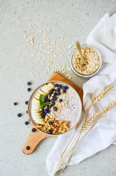 an oatmeal bowl with blueberries, bananas and granola