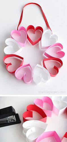 paper hearts are arranged in the shape of heart shapes