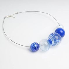 "This Big blue necklace is made of glass in the lampwork technique, each bead is hand blown and unique. This blue chunky necklace is lightweight, stylish and elegant and will become a versatile and irreplaceable addition to your everyday outfits! 💕 You will definitely look stunning in this glass bubble necklace! Dimensions: the necklace length is adjustable, 20\"-22\" inch (51-56cm). Materials: artist lampwork glass beads, metal fittings. 🎁 This large bead necklace will also be a great gift fo Blue Round Glass Beaded Necklace, Blue Murano Glass Beaded Necklace With Large Beads, Blue Round Glass Necklaces, Blue Glass Round Necklaces, Bubble Beads, Navy Necklace, Large Bead Necklace, Lampwork Necklace, Fruit Necklace