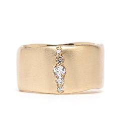 a gold ring with three diamonds on it