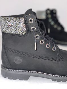 These custom crystallized Timberlands are detailed with Crystals in colour Black Diamond, and sparkle with every step. It's the perfect modern take on a classic boot, they are a showstopper anywhere you go. The perfect mix of casual glamour. Delivery will be 4-6 weeks from date of order. Rhinestone Timberland Boots, Bling Ankle Boots, Black Sparkling Round Toe Boots, Luxury Round Toe Boots With Bling, Bedazzled Round Toe Winter Boots, Bedazzled Winter Boots With Round Toe, Winter Bedazzled Round Toe Boots, Black Glitter Accented Round Toe Boots, Leather Boots With Bling And Round Toe