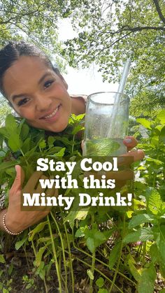 a woman holding up a glass with water in it and the words stay cool with this minty drink