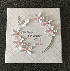 a birthday card with flowers and butterflies on it