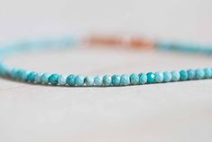 This pretty, delicate stretch bracelet is made of faceted genuine Arizona mined turquoise beads on elastic cord. The turquoise beads vary in color a bit, which creates a lovely, organic look, while the facets and uniform size give a polished feel; a segment of glittery bright orange sapphires shines against the turquoise. This will easily become an everyday favorite! The bracelet is completed with a small metal bead in your choice of sterling silver, gold filled or rose gold filled, which covers Turquoise Faceted Beaded Bracelets, Faceted Turquoise Beaded Bracelets, Turquoise Stretch Bracelet With Faceted Beads, Turquoise Faceted Beads Stretch Bracelet As Gift, Faceted Turquoise Beaded Bracelets For Gift, Pyrite Bracelet, Peach Sapphire, Metal Bead, Labradorite Bracelet