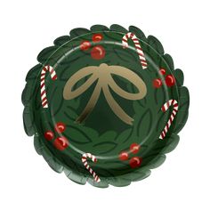 a green paper plate decorated with candy canes and a bow on the center,