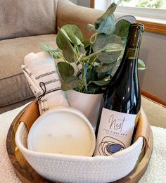 a basket filled with wine bottles and other items