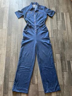 A stunning mint condition stretch denim jumpsuit from the 70s, made by JC Penny Fashions. It has a zipper up the front and adjustable buckles on each side to cinch in the waist. The stitching is done in red which pops against the lovely indigo denim. The tag says size 12T but this fits smaller than a modern 12. I would say this fits a size 8-10 and is definitely tall girl friendly as the torso and pant legs are longer than average. So so so cute! I wish this fit me! Stretch Jumpsuit, Womens Jumpsuits, Indigo Denim, 70s Retro, Tall Girl, Denim Jumpsuit, Stretch Denim, Jumpsuits For Women, Mint Condition