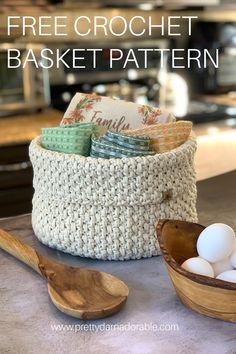 a basket filled with eggs sitting on top of a counter next to a wooden spoon