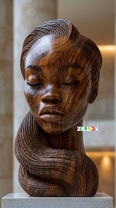 a wooden sculpture is shown with its eyes closed