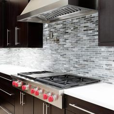 a stove top oven sitting inside of a kitchen next to wooden cabinets and white counter tops