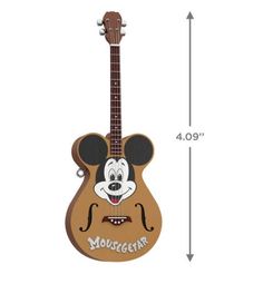 a toy guitar with mickey mouse on it's face and the words mousecraft