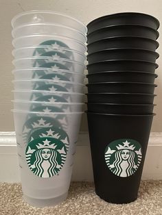 several starbucks cups stacked on top of each other