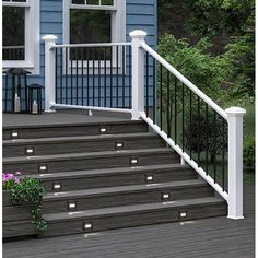 some lights that are on the side of a set of steps near a door and window