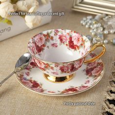 a tea cup and saucer on a table