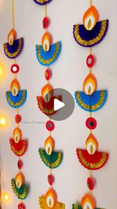 colorful paper hangings with lights on the wall in front of it, and an image of