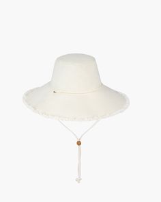 Sandy Soft Cream Eric Javits Wide Brim Sun Hat With Fringe, Spring Brimmed Hat With Fringe, Adjustable Flat Brim Hat With Fringe, Adjustable Fringe Hats, Adjustable Cream Sun Hat For Travel, Casual Adjustable Sun Hat With Fringe, Casual Sun Hat With Fringe, Casual Sun Hat With Fringe And Curved Brim, Wide Brim Spring Hat With Fringe