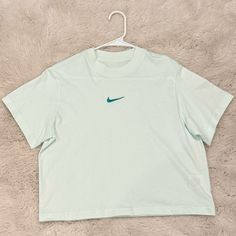 Girl’s Nike Sportswear Essentials Boxy Tee; Mint Foam; Size L; Never Worn; 100% Cotton; Excellent Condition Nike Cropped Short Sleeve T-shirt For Sports, Blue Letter Print Sportswear Tops, Blue Sporty Cropped Crew Neck T-shirt, Blue Sporty Cropped T-shirt With Crew Neck, Green Sporty Cropped Cotton T-shirt, Sporty Blue Cropped T-shirt With Crew Neck, Green Cotton Sporty Cropped T-shirt, Sporty Green Cotton Cropped T-shirt, Green Cotton Cropped T-shirt Sporty Style