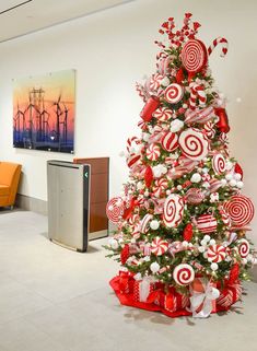 a christmas tree decorated with red and white candy canes