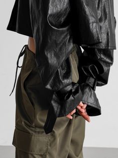 Trendy and chic vegan leather cropped trench made with high quality PU. The fabric has natural stretch and a look of genuine lambskin. Oversized collar and belted cuff sleeves. Model is wearing MINUSEY ONE SIZE. ✔️ Free worldwide express shipping over $100✔️ Loved by 6,500+ customers✔️ Limited edition collections, maximum style⠀⠀⠀⠀⠀⠀⠀⠀⠀Stay ahead of the trend with can’t-find-anywhere-else staples. Your closet will thank you 💕 * MINUSEY ONE SIZE = EU 34-38, US 2-6* 100% PU Leather* Dry clean* Made in Korea - Model Height: 170cm/5'7" (US2, EU34) Leather Jacket With Belted Cuffs, Spring Leather Jacket With Belted Cuffs, Spring Leather Jacket With Belted Cuffs And Long Sleeves, Fall Cropped Belted Jacket, Chic Belted Cropped Outerwear, Chic Cropped Belted Outerwear, Spring Leather Cropped Jacket, Modern Leather Cropped Jacket For Spring, Chic Leather Cropped Jacket For Spring