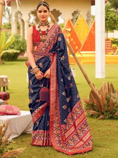 Upgrade your wardrobe with this stunning astonishing navy-blue patola printed silk festival wear saree from Ethnic Plus. This saree will instantly elevate your style and make you the center of attention at any wedding, festival, or special occasion.
Crafted with meticulous attention to detail, this saree features a rich navy blue color and is made from luxurious silk material. The patola printed work all over adds a touch of traditional elegance, and the attached tussles on the pallu enhance the Blue Silk Saree, Indian Wedding Fashion, Sarees Collection, Art Silk Sarees, Printed Saree, Dress Order, Silk Wedding, Blouse Material, Silk Sarees Online