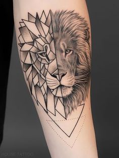 a black and white photo of a lion and cub tattoo on the arm