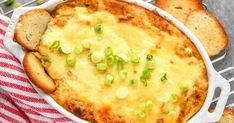 a casserole dish with bread and green onions