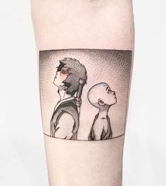 a man and woman looking at each other while standing in front of a mirror tattoo on the leg