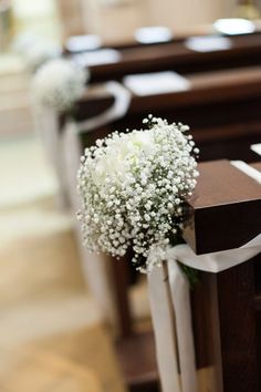 baby's breath flowers on the pews of a church