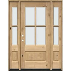 a wooden door with glass panels and sidelights on the front of a house or home