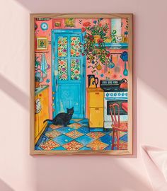 a black cat sitting on the floor in front of a colorful kitchen with an oven