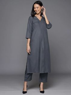 Redefine classics with our kurta sets. This stunning set was crafted from the finest cotton blend in a striking sharp grey hue making it a chic sartorial pick for a stylish office soiree or a quick fun day out with friends and family. Add this stylish piece to your collection now! No. of pieces - 2 piece set. Color - Grey. Fabric - Cotton Blend. Washing Instructions - Dry Clean. Unstitched Cotton V-neck Kurta, Cotton V-neck Kurta For Diwali, Gray Straight Kurta For Festive Occasions, Elegant Cotton Sets For Diwali, Festive Elegant Cotton Kurta, Elegant Semi-formal Straight Kurta Set, Elegant Semi-formal Set With Straight Kurta, Elegant Gray Sets For Eid, Cotton Kurta For Work And Eid