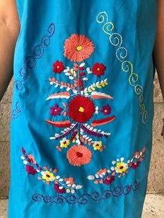 "Beautiful mini embroidered dress, off shoulder, ideal for spring and summer, mexican parties, etc. Bright and colourful Loose fit Made of cotton Fits size Medium Measurements taken flat: Armpit to armpit 20 1/2\" Width 24 1/2\" Length 35\"" Summer Dresses With Floral Embroidery For Beach Season, Sleeveless Floral Embroidered Beach Dress, Sleeveless Dresses With Floral Embroidery For Beach Season, Sleeveless Floral Embroidered Dress For Beach Season, Summer Sundress With Floral Embroidery For Beach, Bohemian Dresses With Floral Embroidery For Beach Season, Bohemian Sundress With Floral Embroidery, Blue Floral Embroidery Summer Dress, Embroidered Summer Sundress For Vacation