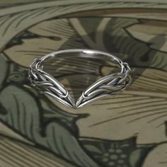 To see our entire Elven collection, click here: https://www.etsy.com/shop/MetalWendler?ref=seller-platform-mcnav&search_query=elvish This Woodlands Vine Fantasy themed engagement ring is made from recycled gold and is handmade with a comfort fit to your size. Perfect for the nature lover.  Ring Specs: ● Band is 6.8mm at widest point, then tapers thinner towards the bottom for an elegant curve.  ● Metals: 10-18k gold. This ring is available with different metals, message me about your idea.   I o Elven Inspired Engagement Ring, Elf Wedding Ring, Acotar Inspired Rings, Elf Jewelry Rings, Elvish Rings Engagement, Elven Jewelry Rings, Fantasy Rings Engagement, Elven Style Metal Jewelry For Gifts, Elvish Engagement Rings