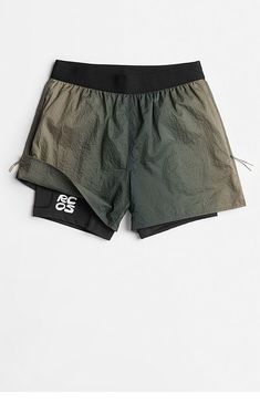 a pair of black and green shorts on a white background