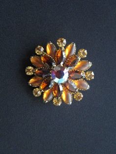 "Mesmerizing Vintage From Designer JUDY LEE Jewelry Navette or Marquise Round Cut Amber Citrine Colored Rhinestone With Frosted Glass and Aurora Borealis Crystal Rhinestone Filigree Gold Tone Floral Design Brooch and Earrings Measures brooch 2\" across and each earring 1-7/8\" across. each piece is signed Judy-Lee. Each piece is in very good vintage condition with minor signs of wear due to its age. Overall they're beautiful clean and ready to wear!. For more beautiful and fabulous of vintage je Orange Brooch Jewelry For Party, Orange Brooch Jewelry For Formal Occasions, Vintage Orange Brooches For Wedding, Formal Orange Brooch Jewelry, Orange Citrine, Aurora Borealis Crystal, Gold Chain Jewelry, Monogram Design, Chain Link Necklace