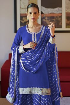 Royal blue crepe kurta with silver kashmiri tilla embroidered placket and cuffs. Comes with chiffon leheriya printed sharara and a dupatta. - Aza Fashions Transitional Georgette Kurta With Embroidered Border, Long Sleeve Georgette Kurta With Embroidered Border, Blue Georgette Sets With Embroidered Border, Traditional Blue Palazzo Set For Formal Occasions, Traditional Blue Formal Palazzo Set, Elegant Georgette Kurta With Embroidered Border, Elegant Blue Kurta With Mirror Work, Blue Long Sleeve Salwar Kameez With Embroidered Border, Blue Long Sleeve Traditional Wear In Georgette