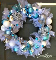 a wreath with blue and white ornaments on it