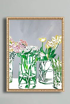 a painting of flowers in vases on a table next to a gray wall with gold frame