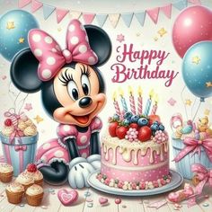 a minnie mouse birthday cake with candles and balloons