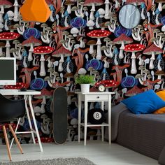 a living room filled with furniture and wallpaper covered in colorful mushrooms on the walls