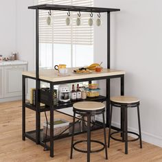 a kitchen island with two stools next to it and an open shelf on the side